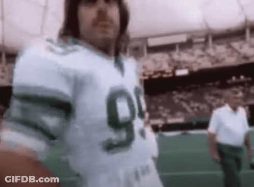 Man In Green And White Football Jersey Number 90 GIF