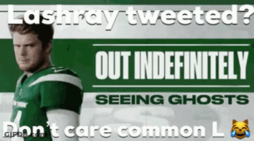 Man In Green And White Jersey In Front Of Lashray Tweeted Sign GIF
