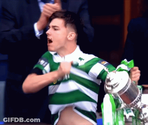 Man In Green And White Striped Shirt Holding Trophy GIF