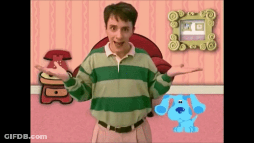 Man In Green And White Striped Shirt Next To Blue Dog GIF