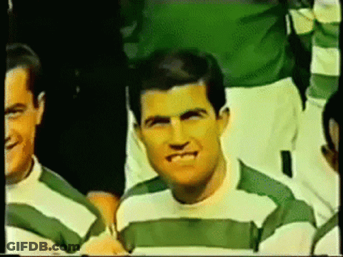 Man In Green And White Striped Shirt Smiling GIF