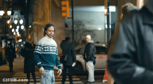 Man In Green And White Sweater Walking GIF