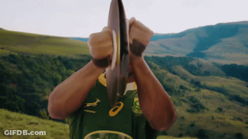 Man In Green And Yellow Asics Jersey Holding Plate GIF