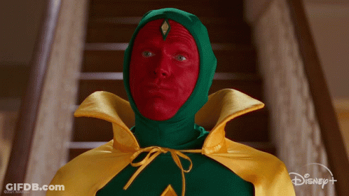 Man In Green And Yellow Cape With Red Paint Saying Yes GIF