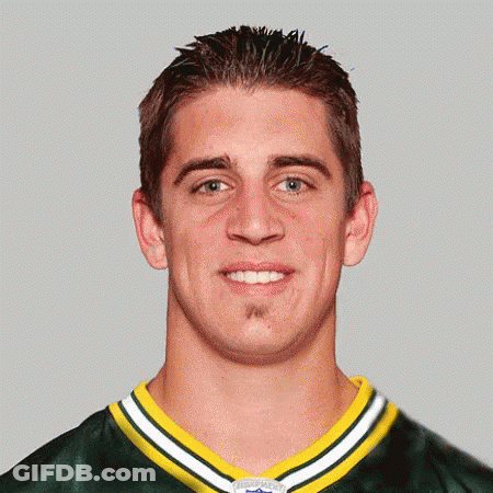 Man In Green And Yellow Jersey Smiling GIF