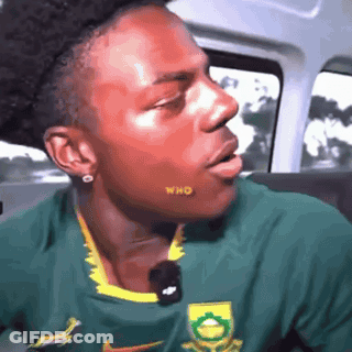 Man In Green And Yellow Nike Shirt In Car GIF