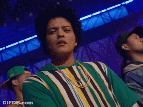 Man In Green And Yellow Striped Shirt And Necklace GIF