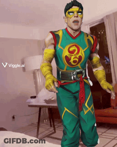 Man In Green And Yellow Superhero Costume GIF