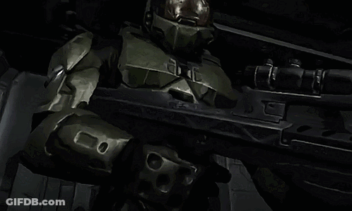 Man In Green Armor Holding Rifle With Letter E GIF
