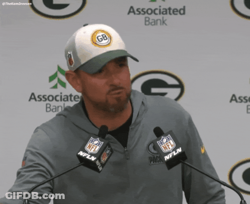 Man In Green Bay Packers Hat At Podium GIF