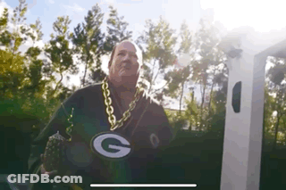 Man In Green Bay Packers Jersey And Gold Chain At Charging Station GIF
