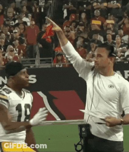 Man In Green Bay Packers Shirt Talks To Player GIF