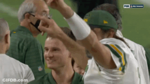 Man In Green Bay Packers Uniform Arms Up GIF