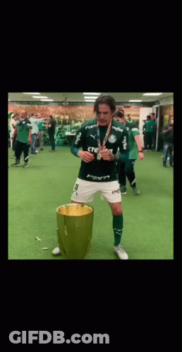 Man In Green Crefisa Shirt Before Trophy GIF