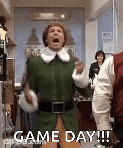 Man In Green Elf Costume Celebrating GIF