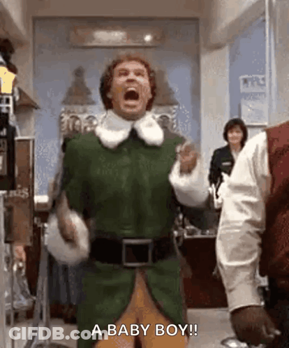 Man In Green Elf Costume Shouting Baby GIF