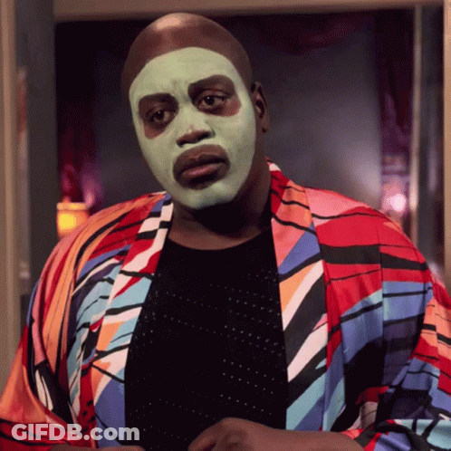 Man In Green Face Mask And Colorful Jacket GIF