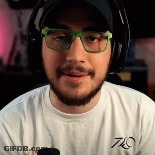 Man In Green Glasses, Headphones, And White T-Shirt With 7Q GIF