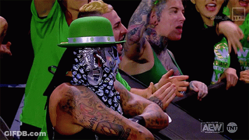Man In Green Hat And Bandana Applauding Wrestling GIF