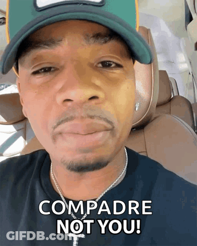 Man In Green Hat And Black Shirt Says Compadre Not You GIF