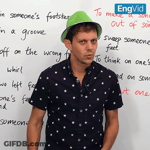 Man In Green Hat In Front Of To Make A Song Out Of GIF