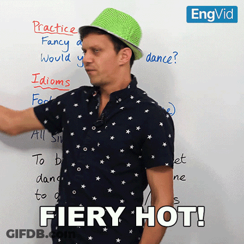 Man In Green Hat In Front Of Whiteboard Fiery Hot GIF