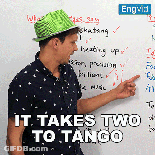 Man In Green Hat Pointing At It Takes Two To Tango GIF