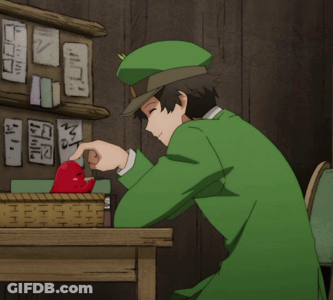 Man In Green Hat Pointing At Red Object GIF