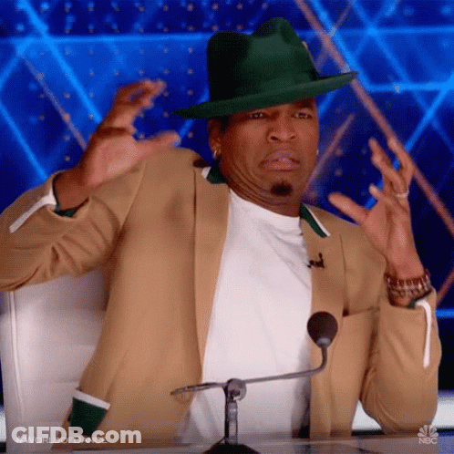 Man In Green Hat Sitting At Microphone GIF