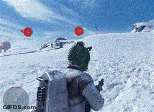 Man In Green Hat Standing In Snow With Gun GIF