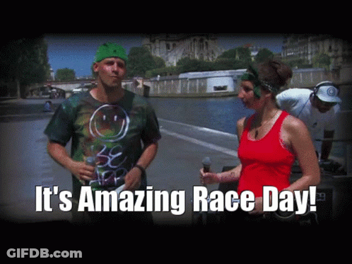Man In Green Hat Talking To Woman In Red Tank GIF