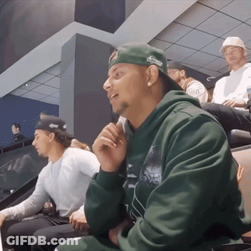 Man In Green Hoodie And Green Hat Saying Aarons GIF