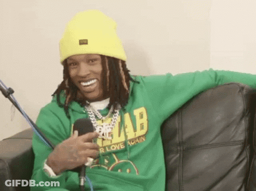 Man In Green Hoodie And Yellow Beanie On Couch GIF