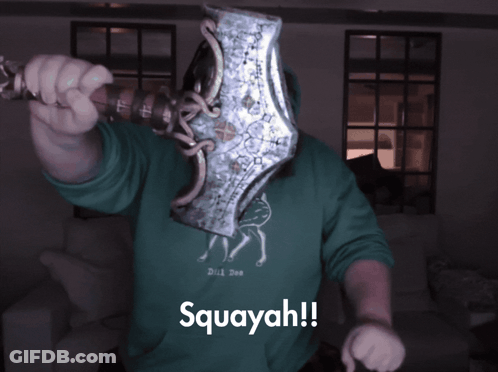 Man In Green Hoodie Holding Axe GIF
