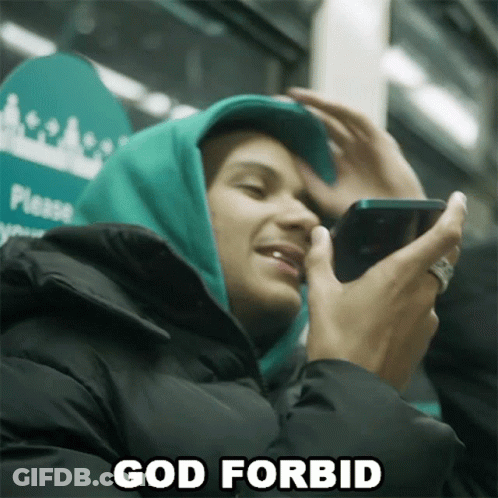 Man In Green Hoodie Holding Cell Phone Says God Forbid GIF