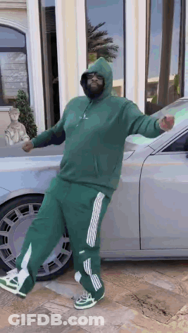 Man In Green Hoodie Standing In Front Of Car GIF