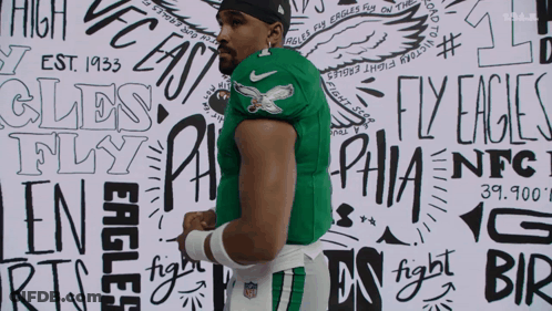 Man In Green Hurts Jersey GIF
