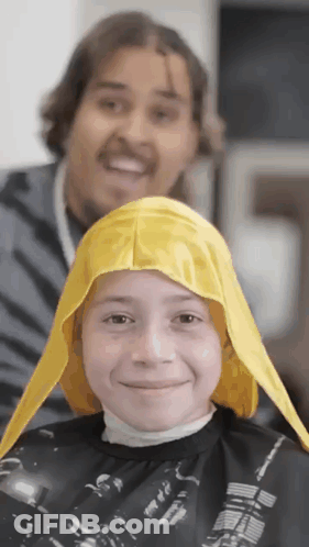 Man In Green Jacket And Blue Shirt Standing In Front Of House GIF