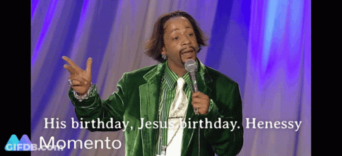 Man In Green Jacket And Tie At Microphone GIF
