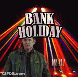 Man In Green Jacket At Bank Holiday Sign GIF