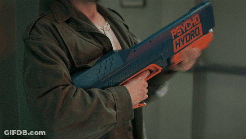 Man In Green Jacket Holding Psycho Hydro Water Gun GIF
