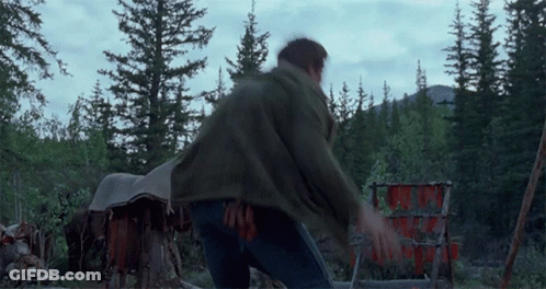 Man In Green Jacket In Forest GIF