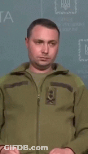 Man In Green Jacket In Front Of Office Of The President Of Ukraine GIF