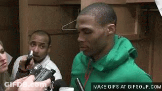 Man In Green Jacket Interviewed By Reporter In Locker Room GIF