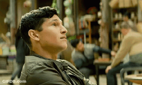 Man In Green Jacket Looking Up GIF