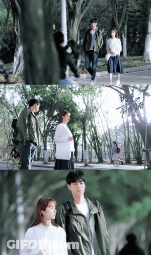 Man In Green Jacket Next To Woman In White Sweater GIF