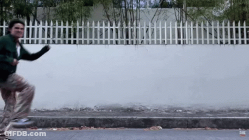 Man In Green Jacket Running GIF