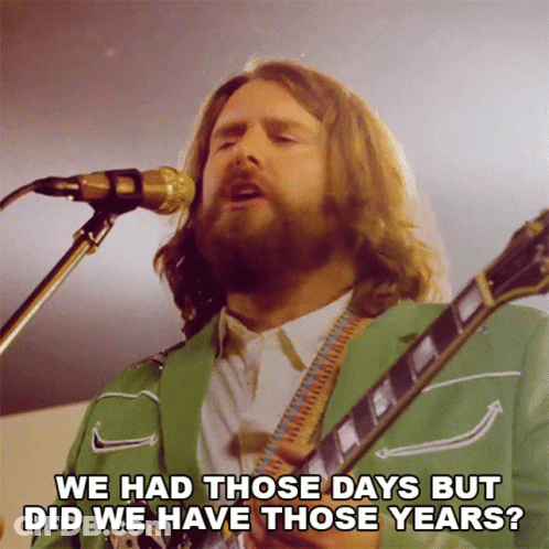 Man In Green Jacket Singing Into Microphone GIF