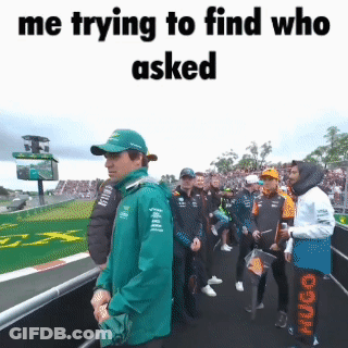 Man In Green Jacket Standing In Crowd Saying Me Trying To Find Who Asked GIF