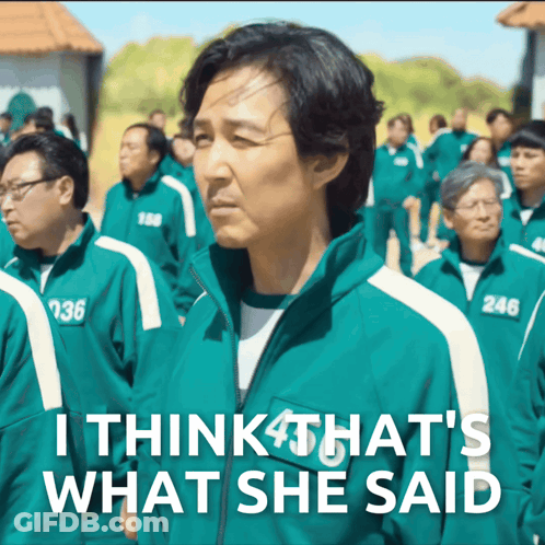 Man In Green Jacket With Number 246 Standing In Crowd GIF